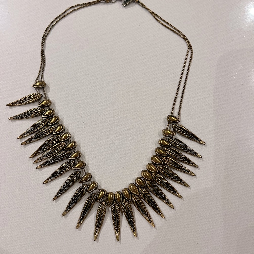 Beautiful gold feather necklace. Excellent condition. Worn once. Locally made.